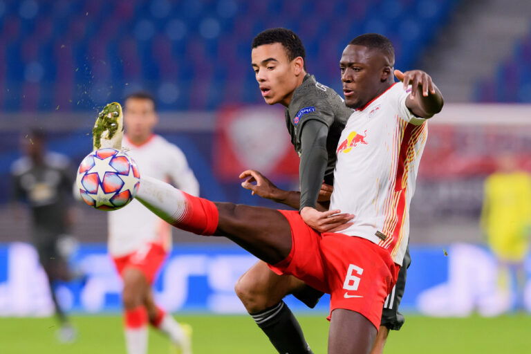 LEIPZIG, GERMANY - DECEMBER 08: (BILD ZEITUNG OUT) Mason Greenwood of Manchester United and Ibrahima Konate of RasenBallsport Leipzig battle for the ball during the UEFA Champions League Group H stage match between RB Leipzig and Manchester United at Red Bull Arena on December 8, 2020 in Leipzig, Germany.