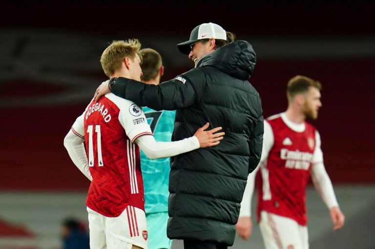 LONDON, ENGLAND - APRIL 03: Martin Odegaard of Arsenal and Liverpool Manager Jurgen Klopp chat after the Premier League match between Arsenal and Liverpool at Emirates Stadium on April 03, 2021 in London, England.