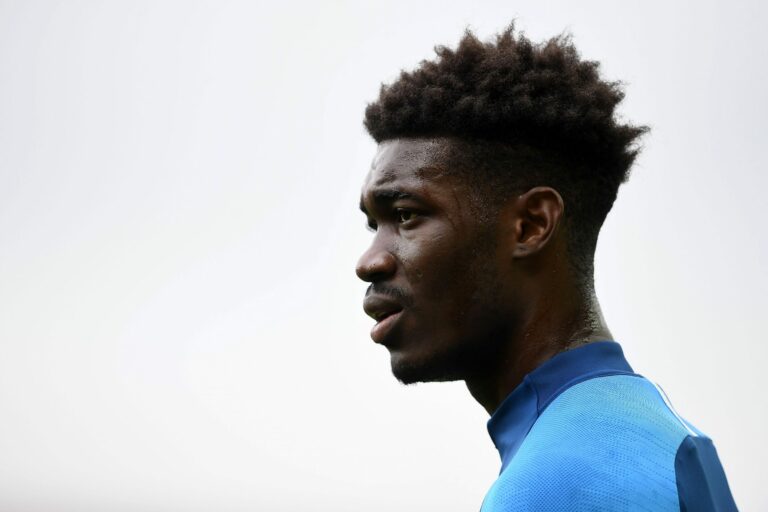 NORWICH, ENGLAND - JULY 04: Yves Bissouma of Brighton and Hove Albion looks on as he warms up prior t the Premier League match between Norwich City and Brighton & Hove Albion at Carrow Road on July 04, 2020 in Norwich, England.