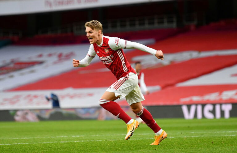 LONDON, ENGLAND - MARCH 14: Martin Odegaard of Arsenal celebrates after scoring their side's first goal during the Premier League match between Arsenal and Tottenham Hotspur at Emirates Stadium on March 14, 2021 in London, England.
