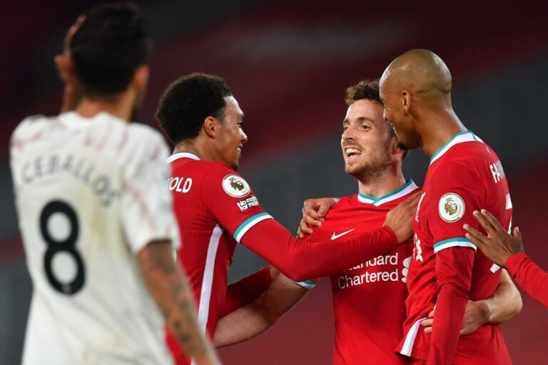 LIVERPOOL, ENGLAND - SEPTEMBER 28: Diogo Jota of Liverpool celebrates with teammates after scoring his sides third goal during the Premier League match between Liverpool and Arsenal at Anfield on September 28, 2020 in Liverpool, England.