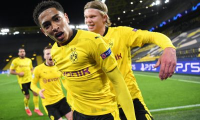 Dortmund's English midfielder Jude Bellingham (C) celebrates scoring the opening goal with his teammates including Dortmund's Norwegian forward Erling Braut Haaland (R) during the UEFA Champions League quarter-final second leg football match between BVB Borussia Dortmund and Manchester City in Dortmund, western Germany, on April 14, 2021. (Photo by INA FASSBENDER/AFP via Getty Images)