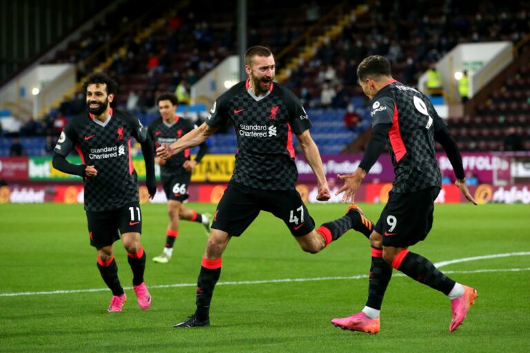 BURNLEY, ENGLAND - MAY 19: Nathaniel Phillips of Liverpool celebrates with team mate Roberto Firmino after scoring their side's second goal during the Premier League match between Burnley and Liverpool at Turf Moor on May 19, 2021 in Burnley, England.