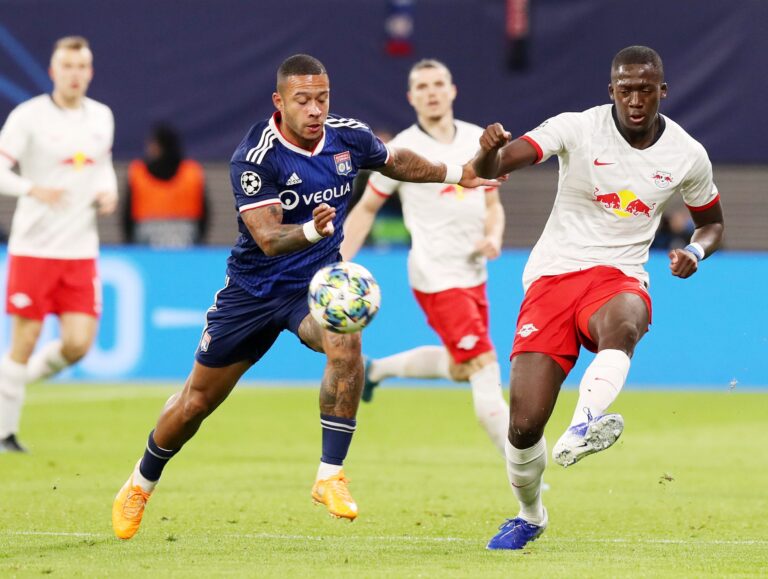 LEIPZIG,GERMANY,02.OCT.19 - SOCCER - UEFA Champions League, group stage, RasenBallsport Leipzig vs Olympique Lyon. Image shows Memphis Depay (Lyon) and Ibrahima Konate.