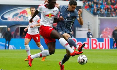 LEIPZIG, GERMANY - MAY 11: Ibrahima Konate of RB Leipzig and Robert Lewandowski of FC Bayern Muenchen battle for the ball during the Bundesliga match between RB Leipzig and Bayern Muenchen at Red Bull Arena on May 11, 2019 in Leipzig, Germany.