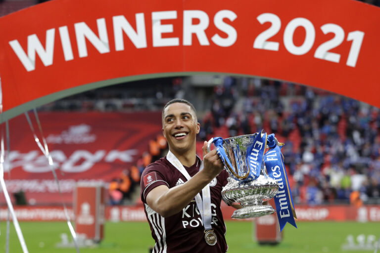 LONDON, ENGLAND - MAY 15: Youri Tielemans of Leicester City celebrates with the Emirates FA Cup trophy following The Emirates FA Cup Final match between Chelsea and Leicester City at Wembley Stadium on May 15, 2021 in London, England.