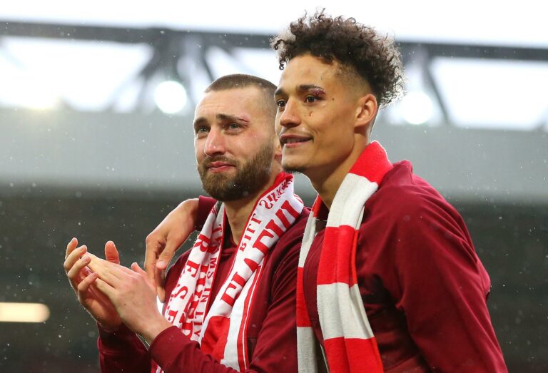 LIVERPOOL, ENGLAND - MAY 23: Nathaniel Phillips and Rhys Williams of Liverpool applauds the fans after the Premier League match between Liverpool and Crystal Palace at Anfield on May 23, 2021 in Liverpool, England.