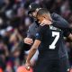 Jurgen Klopp coach of Liverpool talks to Kylian Mbappe of PSG during the Champions League match between Liverpool and Paris Saint Germain at Anfield on September 18, 2018 in Liverpool, England.