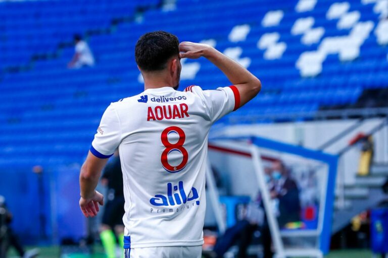 LYON, FRANCE - MAY 08: Houssem Aouar #8 of Olympique Lyonnais celebrates his goal during the Ligue 1 match between Olympique Lyonnais and FC Lorient at Groupama Stadium on May 8, 2021 in Lyon, France.