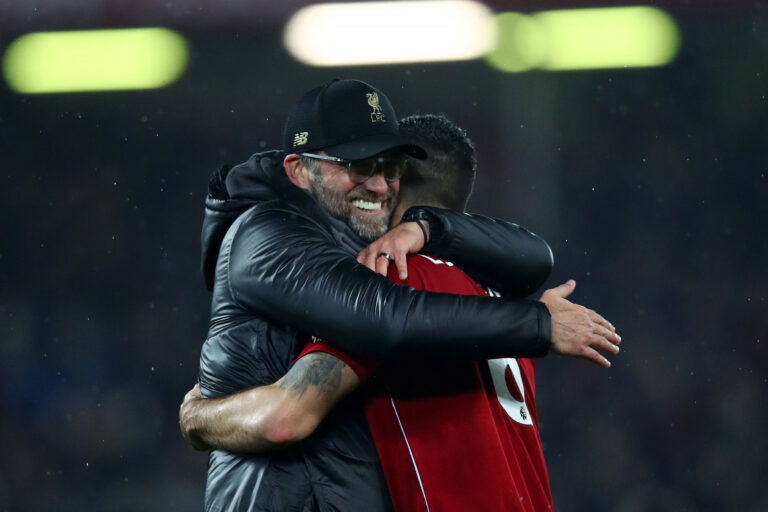 LIVERPOOL, ENGLAND - DECEMBER 16: Jurgen Klopp, Manager of Liverpool and Dejan Lovren of Liverpool celebrate following their sides victory in the Premier League match between Liverpool FC and Manchester United at Anfield on December 16, 2018 in Liverpool, United Kingdom.
