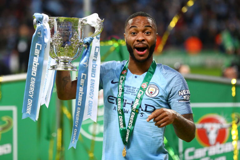 LONDON, ENGLAND - FEBRUARY 24: Raheem Sterling of Manchester City celebrates with the trophy after winning the Carabao Cup Final between Chelsea and Manchester City at Wembley Stadium on February 24, 2019 in London, England.
