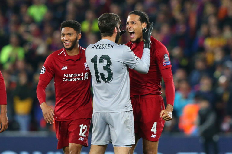 LIVERPOOL, ENGLAND - MAY 07: Alisson Becker and Virgil van Dijk of Liverpool celebrate after the UEFA Champions League Semi Final second leg match between Liverpool and Barcelona at Anfield on May 07, 2019 in Liverpool, England.