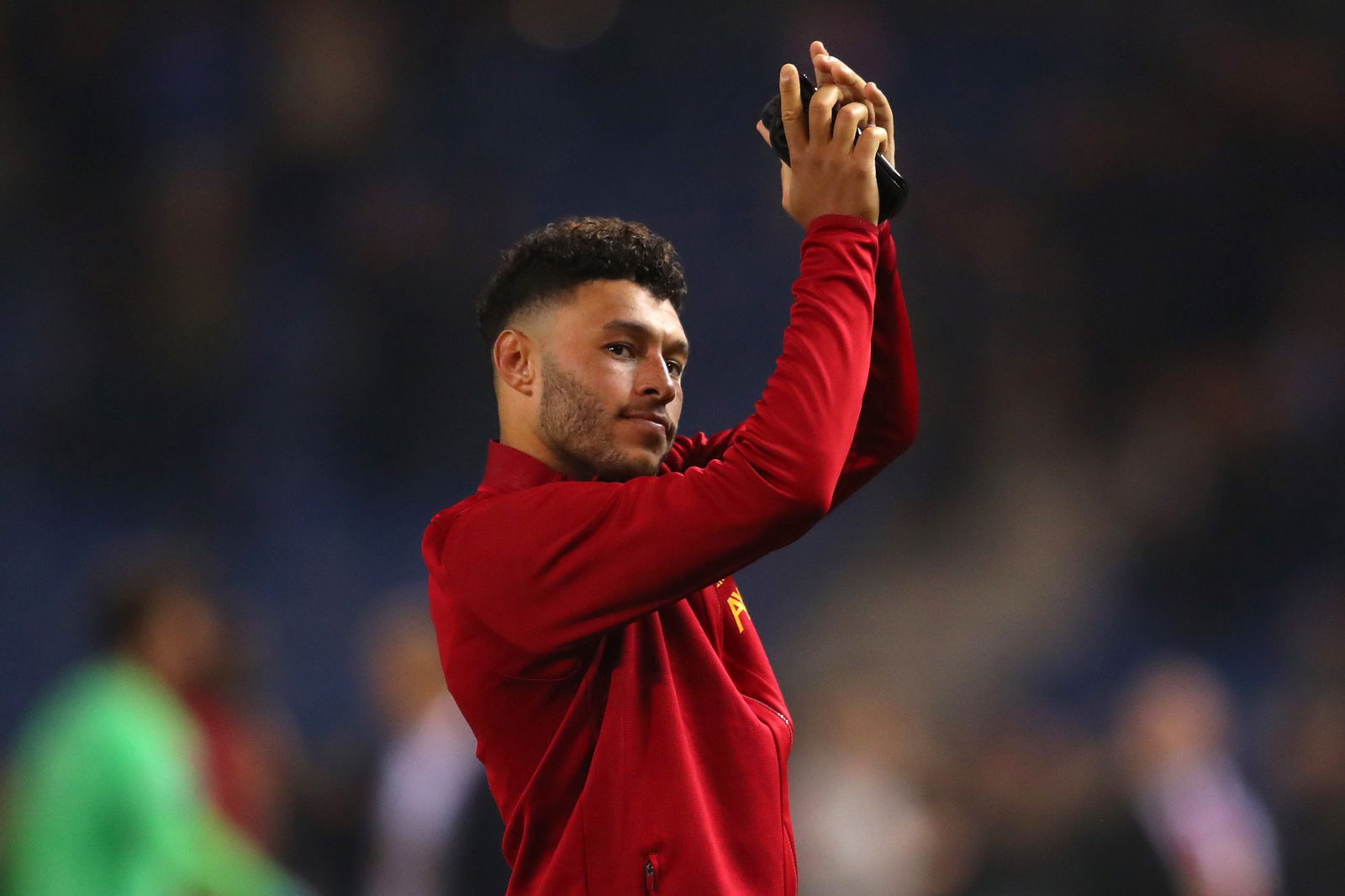 GENK, BELGIUM - OCTOBER 23: Alex Oxlade-Chamberlain of Liverpool applauds fans after the UEFA Champions League group E match between KRC Genk and Liverpool FC at Luminus Arena on October 23, 2019 in Genk, Belgium.