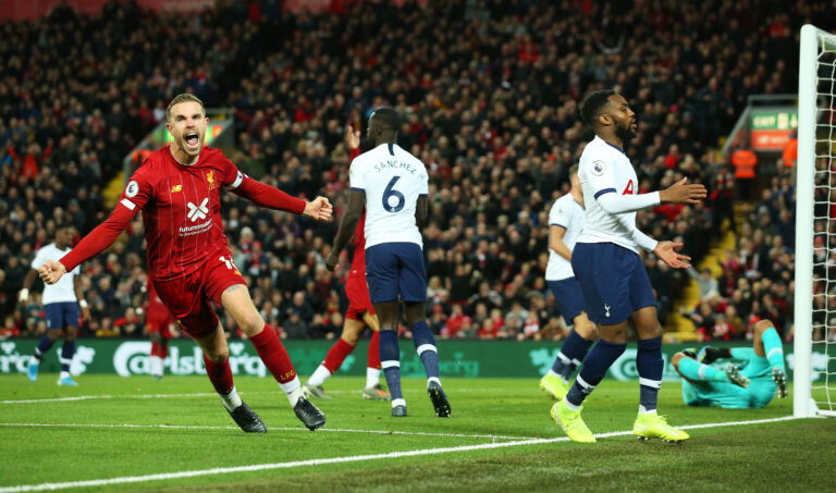 LIVERPOOL, ENGLAND - OCTOBER 27: Jordan Henderson of Liverpool (L) celebrates after scoring his team's first goal during the Premier League match between Liverpool FC and Tottenham Hotspur at Anfield on October 27, 2019 in Liverpool, United Kingdom.