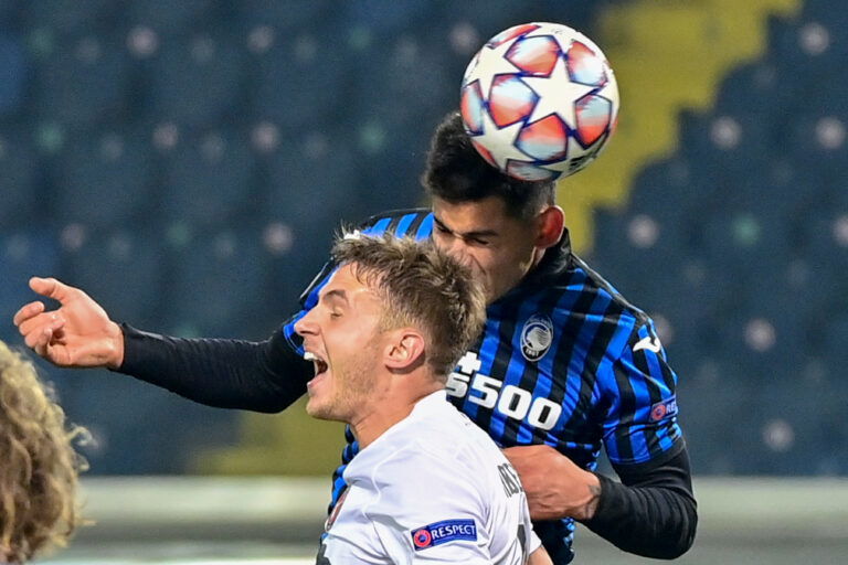 Atalanta's Argentine defender Cristian Romero (Rear) heads the ball to score an equalizer during the UEFA Champions League Group D football match Atalanta vs Midtjylland on December 1, 2020 at the Azzurri d'Italia stadium in Bergamo, Lombardy.