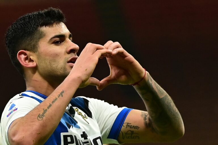Atalanta's Argentine defender Cristian Romero celebrates after opening the scoring during the Italian Serie A football match AC Milan vs Atalanta Bergamo on January 23, 2021 at the San Siro stadium in Milan.