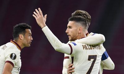 Roma's Italian midfielder Lorenzo Pellegrini (R) celebrates with teammates after scoring a goal during the UEFA Europa League quarter-final football match between Ajax Amsterdam and AS Roma at the Johan Cruijff Arena in Amsterdam on April 8, 2021.