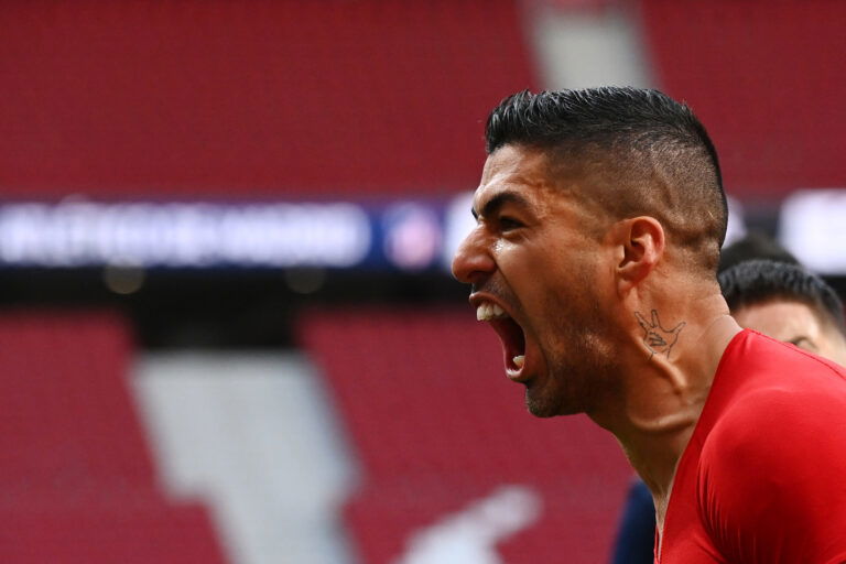 Atletico Madrid's Uruguayan forward Luis Suarez celebrates his goal during the Spanish League football match between Club Atletico de Madrid and CA Osasuna at the Wanda Metropolitano stadium in Madrid on May 16, 2021.