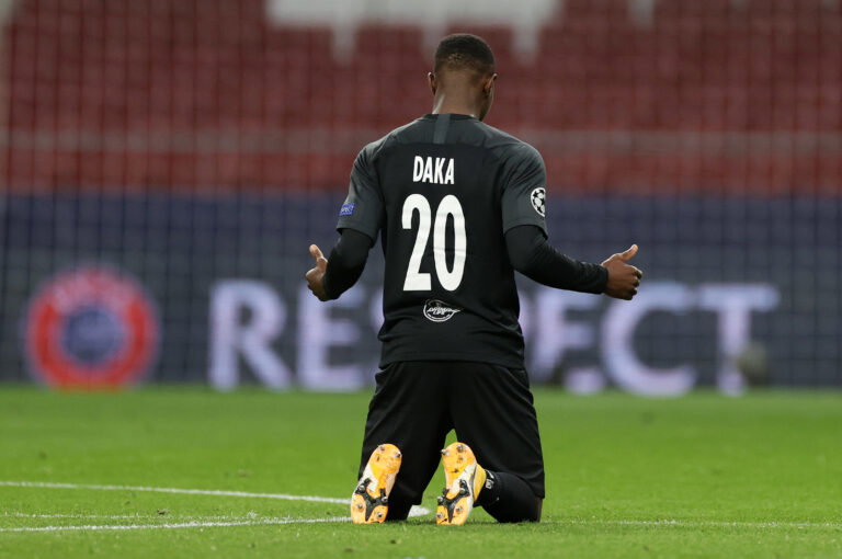 MADRID, SPAIN - OCTOBER 27: Patson Daka of RB Salzburg takes a knee in support of the Black Lives Matter movement during the UEFA Champions League Group A stage match between Atletico Madrid and RB Salzburg at Estadio Wanda Metropolitano on October 27, 2020 in Madrid, Spain.