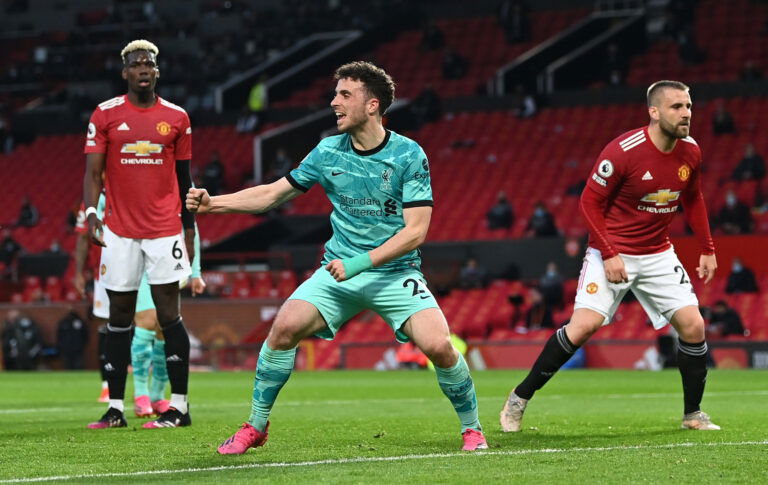 MANCHESTER, ENGLAND - MAY 13: Diogo Jota of Liverpool celebrates after scoring their side's first goal during the Premier League match between Manchester United and Liverpool at Old Trafford on May 13, 2021 in Manchester, England
