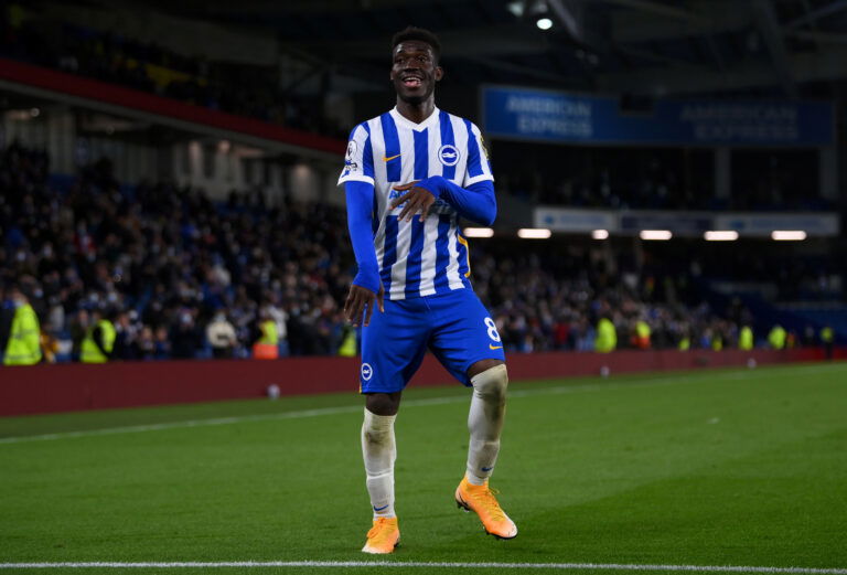 BRIGHTON, ENGLAND - MAY 18: Yves Bissouma of Brighton and Hove Albion celebrates following the Premier League match between Brighton & Hove Albion and Manchester City at American Express Community Stadium on May 18, 2021 in Brighton, England. liverpool