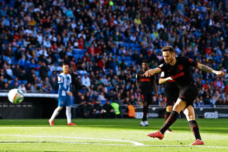 Atletico Madrid's Spanish midfielder Saul Niguez shoots to score a goal during the Spanish League football match between Espanyol and Atletico Madrid at the Cornella-El Prat stadium in Cornella de Llobregat on March 1, 2020.
