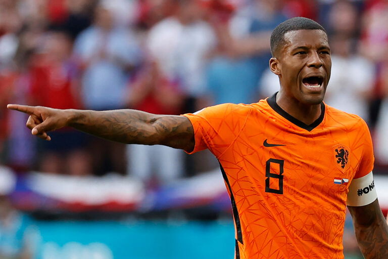 Netherlands' midfielder Georginio Wijnaldum wearing a captain's armband bearing the words "One Love" and a rainbow motif gestures during the UEFA EURO 2020 round of 16 football match between the Netherlands and the Czech Republic at Puskas Arena in Budapest on June 27, 2021.