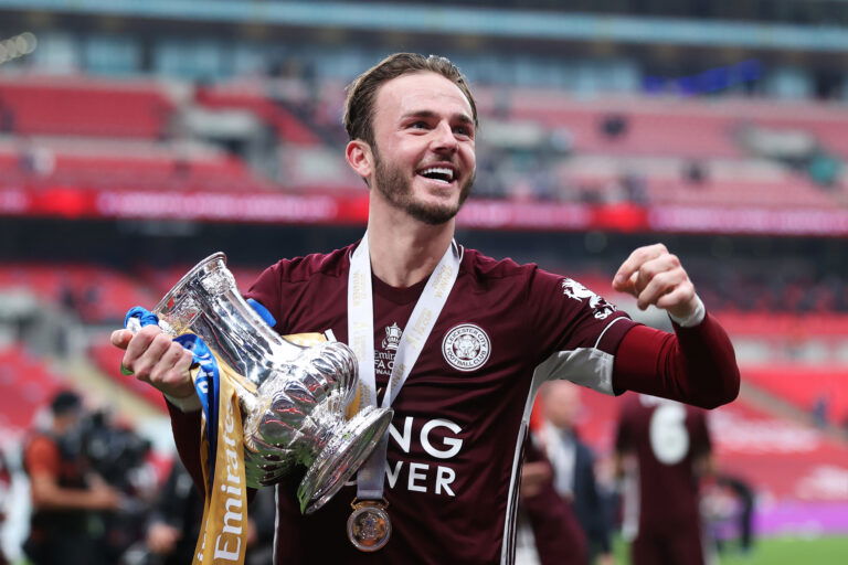 LONDON, ENGLAND - MAY 15: James Maddison of Leicester City holds the trophy as he celebrates after The Emirates FA Cup Final match between Chelsea and Leicester City at Wembley Stadium on May 15, 2021 in London, England.