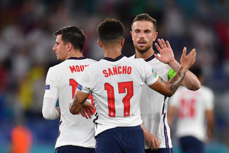 ROME, ITALY - JULY 03: Jordan Henderson of England celebrates with teammate Jadon Sancho after scoring their side's fourth goal during the UEFA Euro 2020 Championship Quarter-final match between Ukraine and England at Olimpico Stadium on July 03, 2021 in Rome, Italy.