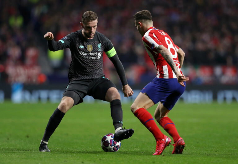 MADRID, SPAIN - FEBRUARY 18: Jordan Henderson of Liverpool is challenged by Saul Niguez of Atletico Madrid during the UEFA Champions League round of 16 first leg match between Atletico Madrid and Liverpool FC at Wanda Metropolitano on February 18, 2020 in Madrid, Spain. (Photo by Angel Martinez/Getty Images)