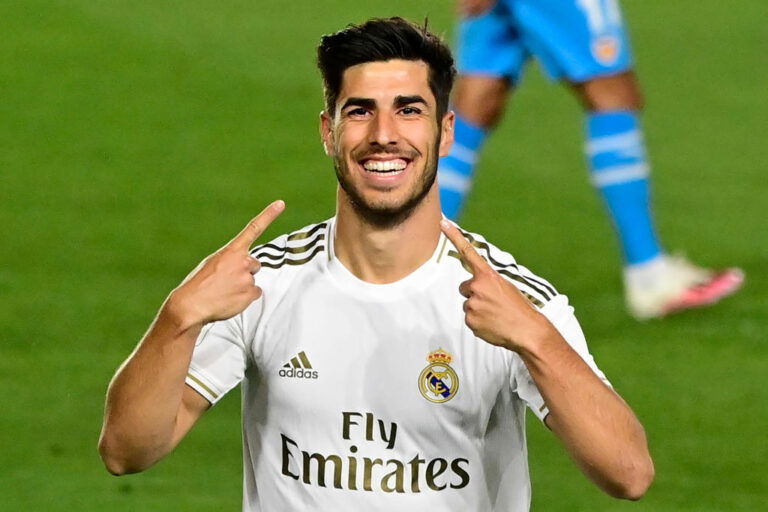 TOPSHOT - Real Madrid's Spanish midfielder Marco Asensio celebrates his goal during the Spanish league football match between Real Madrid CF and Valencia CF at the Alfredo di Stefano stadium in Valdebebas, on the outskirts of Madrid, on June 18, 2020. (Photo by JAVIER SORIANO / AFP) (Photo by JAVIER SORIANO/AFP via Getty Images)