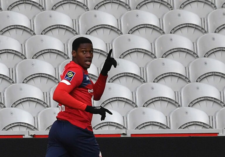 Lille's French forward Jonathan David celebrates after scoring a goal during the French L1 football match between Lille OSC and AS Monaco at the Pierre-Mauroy stadium in Villeneuve-d'Ascq, northern France, on December 6, 2020. (Photo by DENIS CHARLET / AFP) (Photo by DENIS CHARLET/AFP via Getty Images)