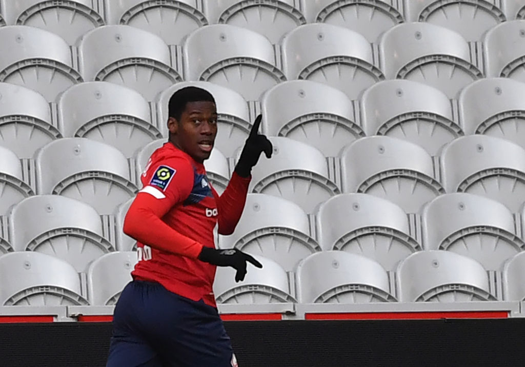 Lille's French forward Jonathan David celebrates after scoring a goal during the French L1 football match between Lille OSC and AS Monaco at the Pierre-Mauroy stadium in Villeneuve-d'Ascq, northern France, on December 6, 2020. (Photo by DENIS CHARLET / AFP) (Photo by DENIS CHARLET/AFP via Getty Images)