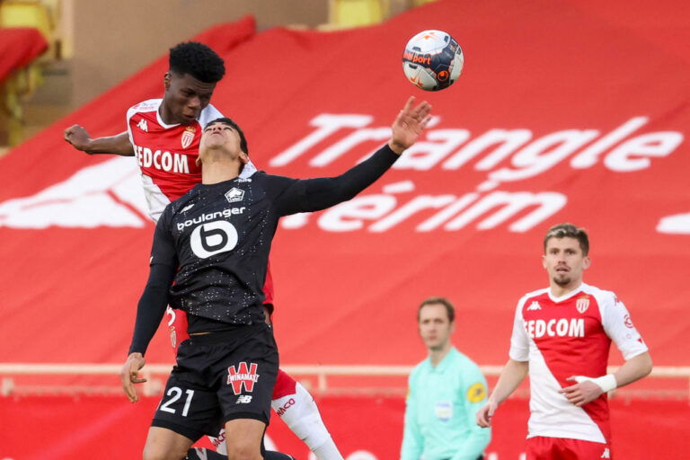 Monaco's French midfielder Aurelien Tchouameni 5L° fights for the ball with Lille's French midfielder Benjamin Andre during the French L1 football match between AS Monaco and Lille (LOSC) at the Louis II stadium in Monaco, on March 14, 2021. (Photo by Valery HACHE / AFP) (Photo by VALERY HACHE/AFP via Getty Images)