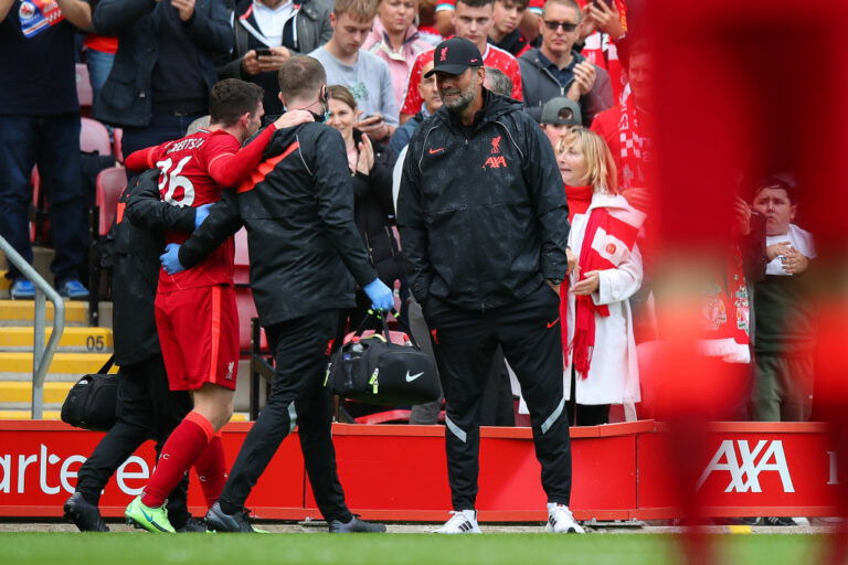 LIVERPOOL, ENGLAND - AUGUST 08: Jurgen Klopp the head coach / manager of Liverpool talks to Andy Robertson of Liverpool as he comes off with an injury during the Pre-Season Friendly fixture between Liverpool and Athletic Club at Anfield on August 8, 2021 in Liverpool, England. (Photo by Robbie Jay Barratt - AMA/Getty Images)
