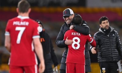 WOLVERHAMPTON, ENGLAND - MARCH 15: Jurgen Klopp, Manager of Liverpool celebrates victory with Naby Keita of Liverpool following the Premier League match between Wolverhampton Wanderers and Liverpool at Molineux on March 15, 2021 in Wolverhampton, England. Sporting stadiums around the UK remain under strict restrictions due to the Coronavirus Pandemic as Government social distancing laws prohibit fans inside venues resulting in games being played behind closed doors. (Photo by Laurence Griffiths/Getty Images)
