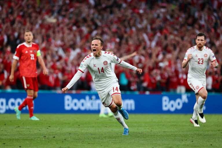 COPENHAGEN, DENMARK - JUNE 21: Mikkel Damsgaard of Denmark celebrates after scoring their side's first goal during the UEFA Euro 2020 Championship Group B match between Russia and Denmark at Parken Stadium on June 21, 2021 in Copenhagen, Denmark. (Photo by Wolfgang Rattay - Pool/Getty Images)