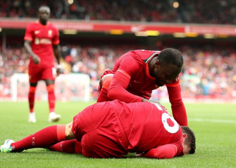 LIVERPOOL, ENGLAND - AUGUST 08: Andy Robertson of Liverpool reacts after an injury during the pre-season friendly match between Liverpool and Athletic Club at Anfield on August 08, 2021 in Liverpool, England. (Photo by Jan Kruger/Getty Images,)