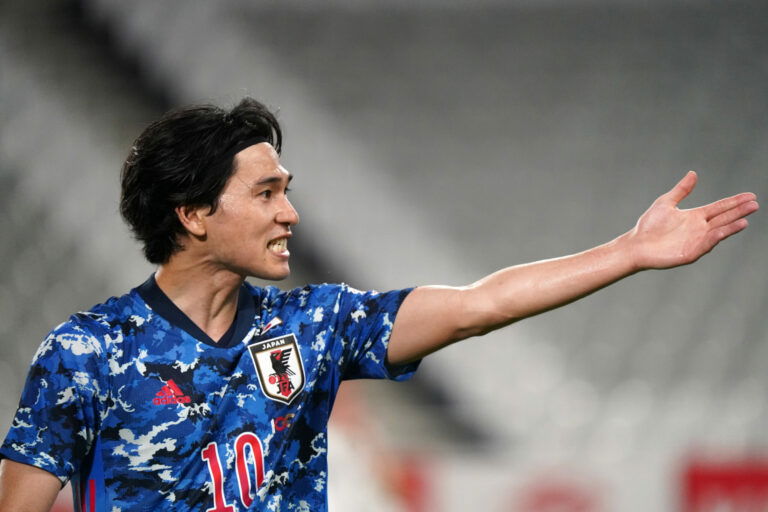 KOBE, JAPAN - JUNE 11: Takumi Minamino of Japan gestures during the international friendly match between Japan and Serbia at Noevir Stadium Kobe on June 11, 2021 in Kobe, Hyogo, Japan. (Photo by Etsuo Hara/Getty Images)