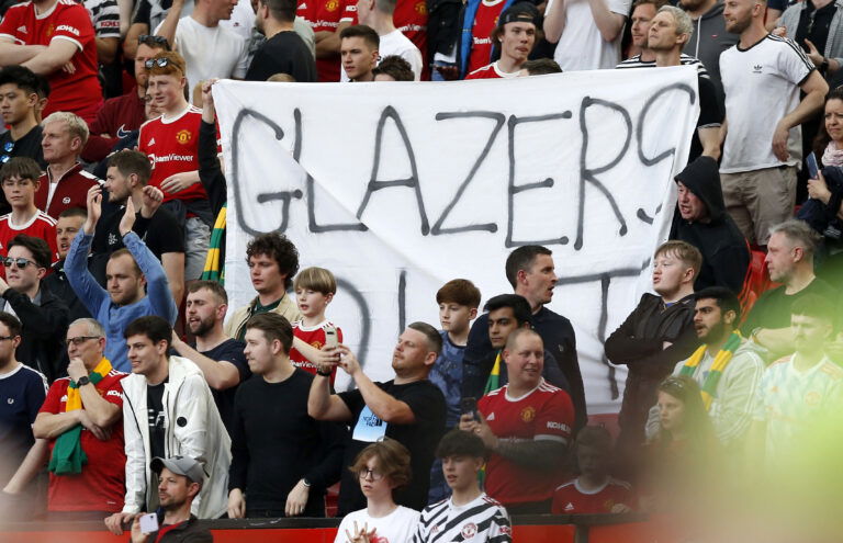 Soccer Football - Premier League - Manchester United v Norwich City - Old Trafford, Manchester, Britain - April 16, 2022 Manchester United fans displays a "Glazers Out" banner REUTERS/Craig Brough