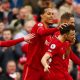 LIVERPOOL, ENGLAND - APRIL 02: Diogo Jota of Liverpool celebrates with teammates (L-R) Andrew Robertson, Virgil van Dijk and Jordan Henderson after scoring their team's first goal during the Premier League match between Liverpool and Watford at Anfield on April 02, 2022 in Liverpool, England. (Photo by Clive Brunskill/Getty Images)
