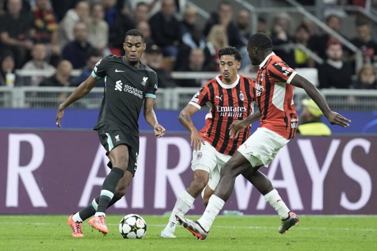 Cody Gakpo (Liverpool FC) and Tijjani Reijnders (AC Milan) battle for the ball, UEFA Champions League 2024/25 League Pha