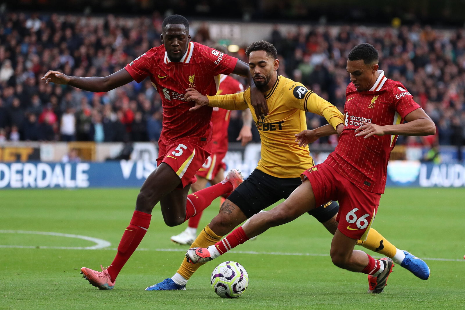 Wolverhampton Wanderers FC v Liverpool FC Matheus Cunha of Wolverhampton Wanderers holds off pressure from Ibrahima Kona