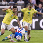 Bruno Guimaraes and Joao Gomes from Brazil during the game between Paraguay and Brazil in the group stage of the Copa Am
