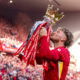 Harvey Elliott celebrating with the Premier League trophy in May 2025